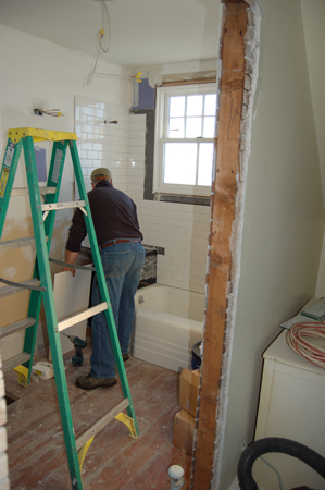 wls, const, 29, at work on refurbishing one of the two original bathrooms